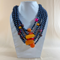 MULTY LAYERED BLUE WOODEN AND RESIN BEAD NECKLACE